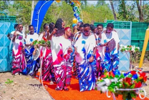 Ceremony arch with guests in blue and white
