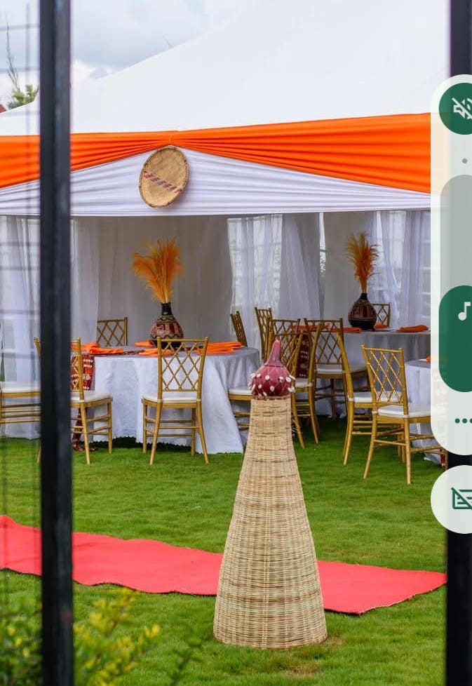 Orange trimmed tent with traditional gourd decor