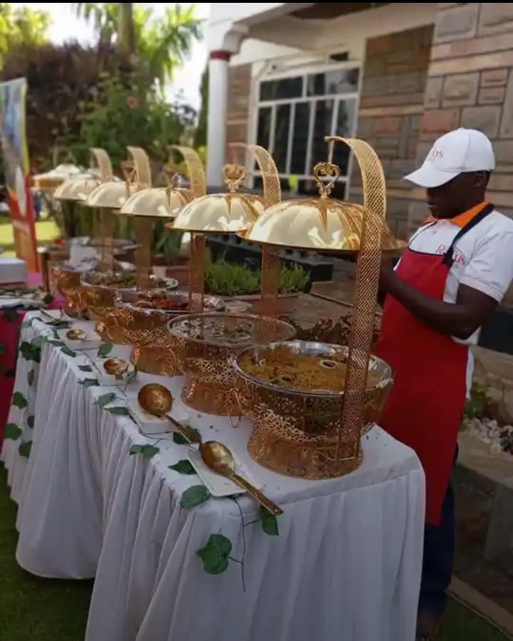 Gold dome chafing dishes on buffet