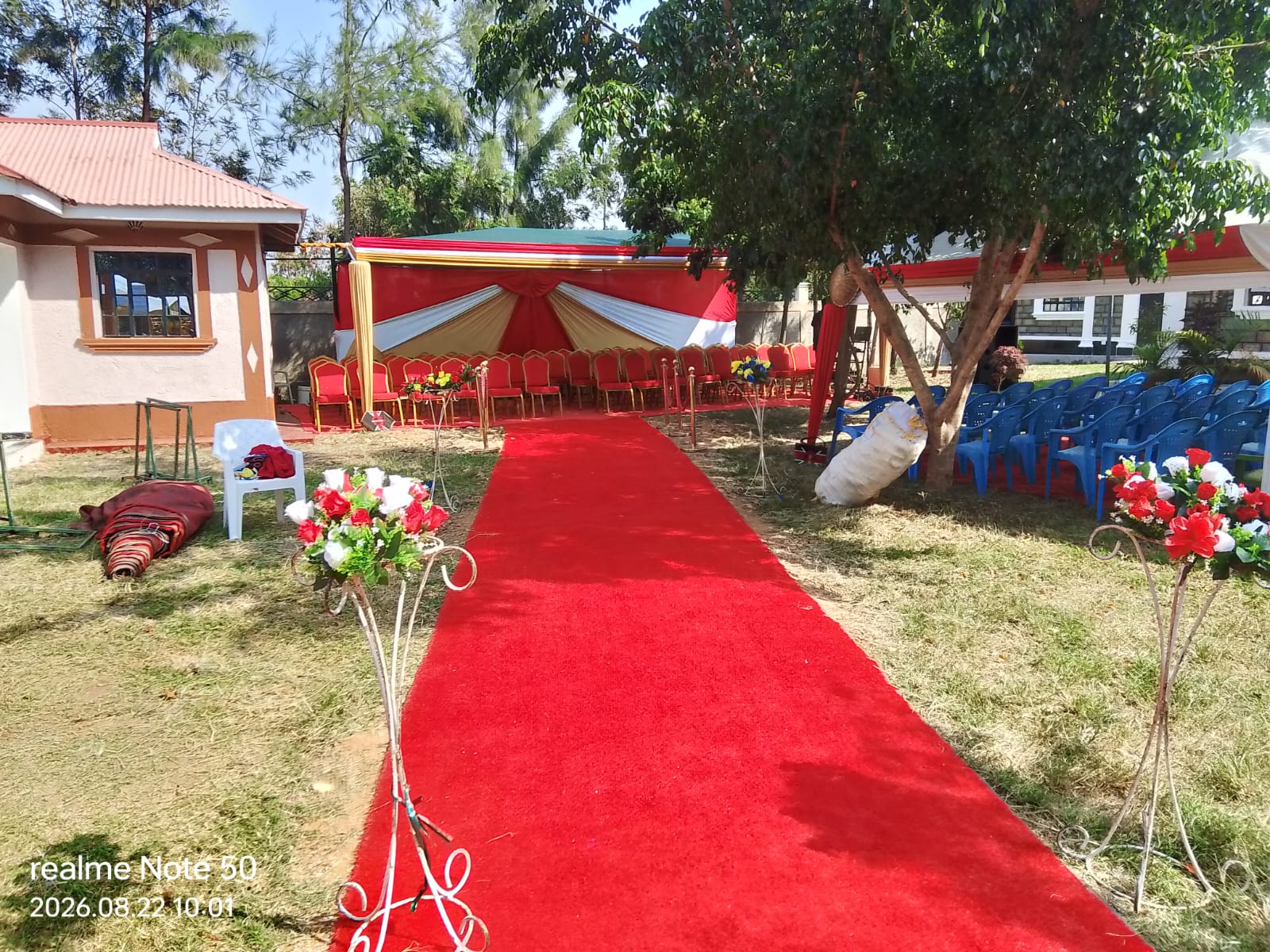 Red and gold tent with red carpet aisle