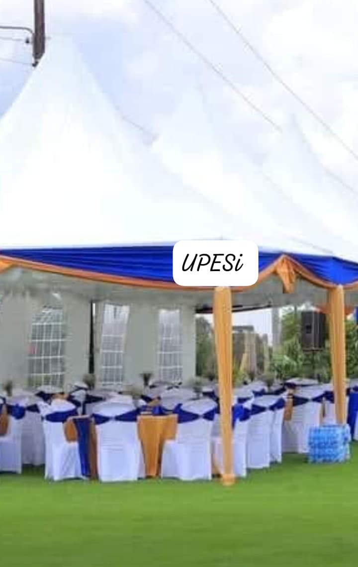 Blue and white wedding gazebo with dressed chairs