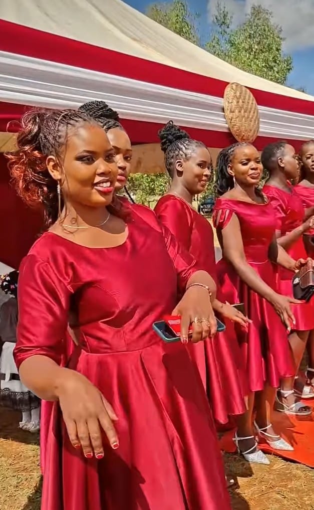 Bridesmaids in red satin dresses